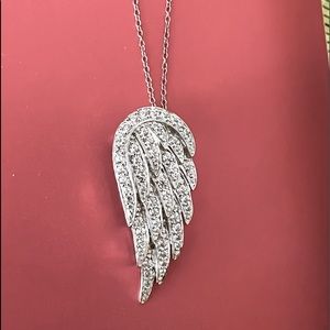 This all silver chain and crystal rich wing resembles a wing and a prayer.